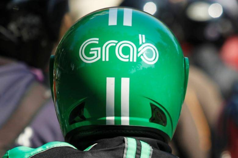 Ride-hailing firm Grab agrees to buy Indonesian payment startup Kudo
